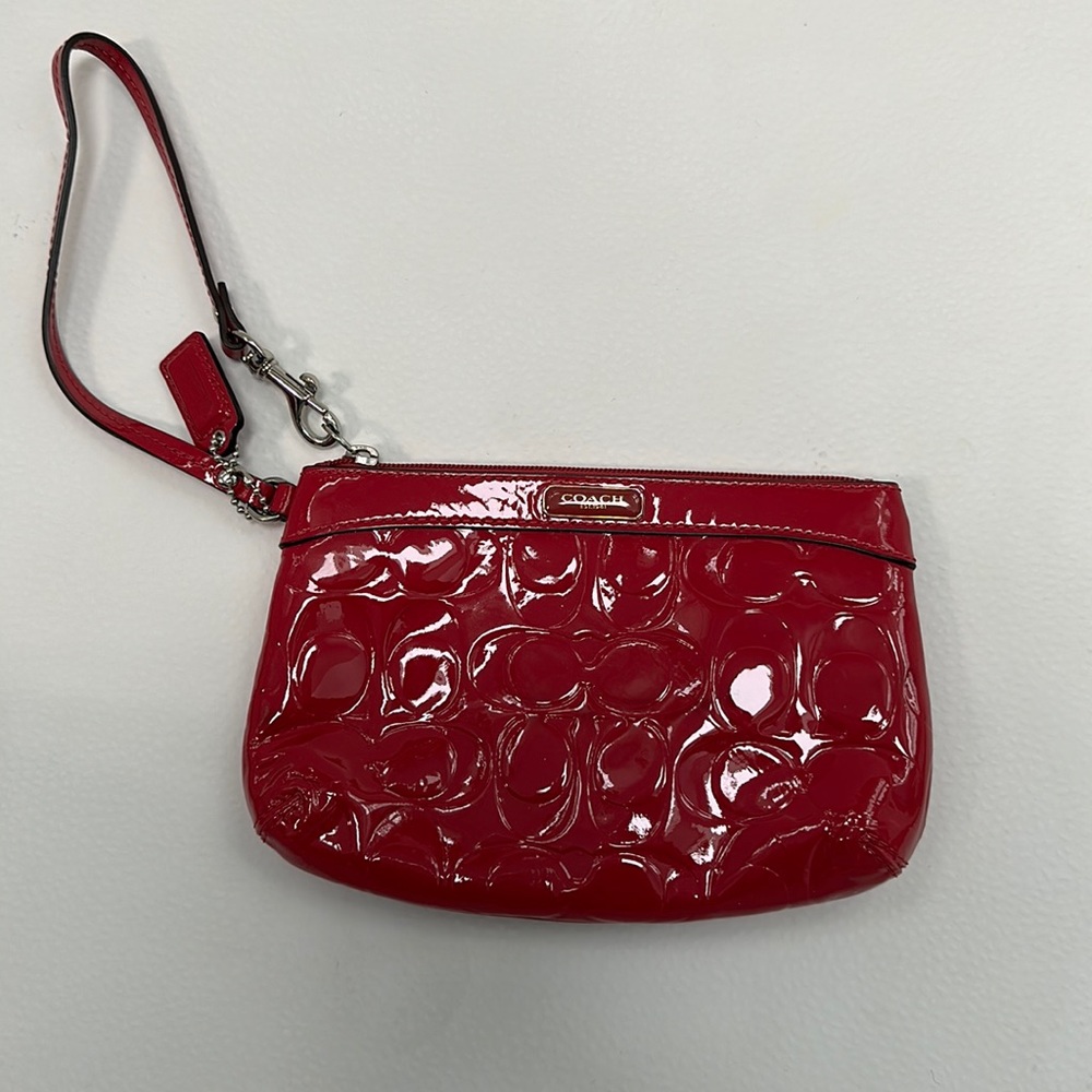 Dark pink Coach wristlet